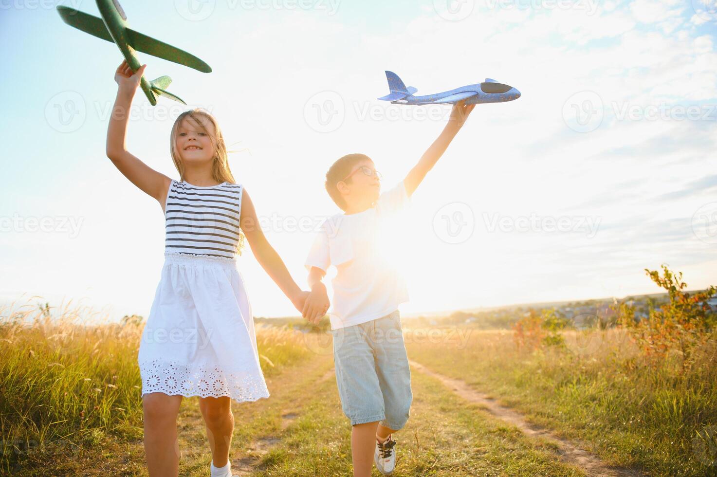 children play toy airplane. concept of happy childhood. children dream of flying and becoming a pilot. photo