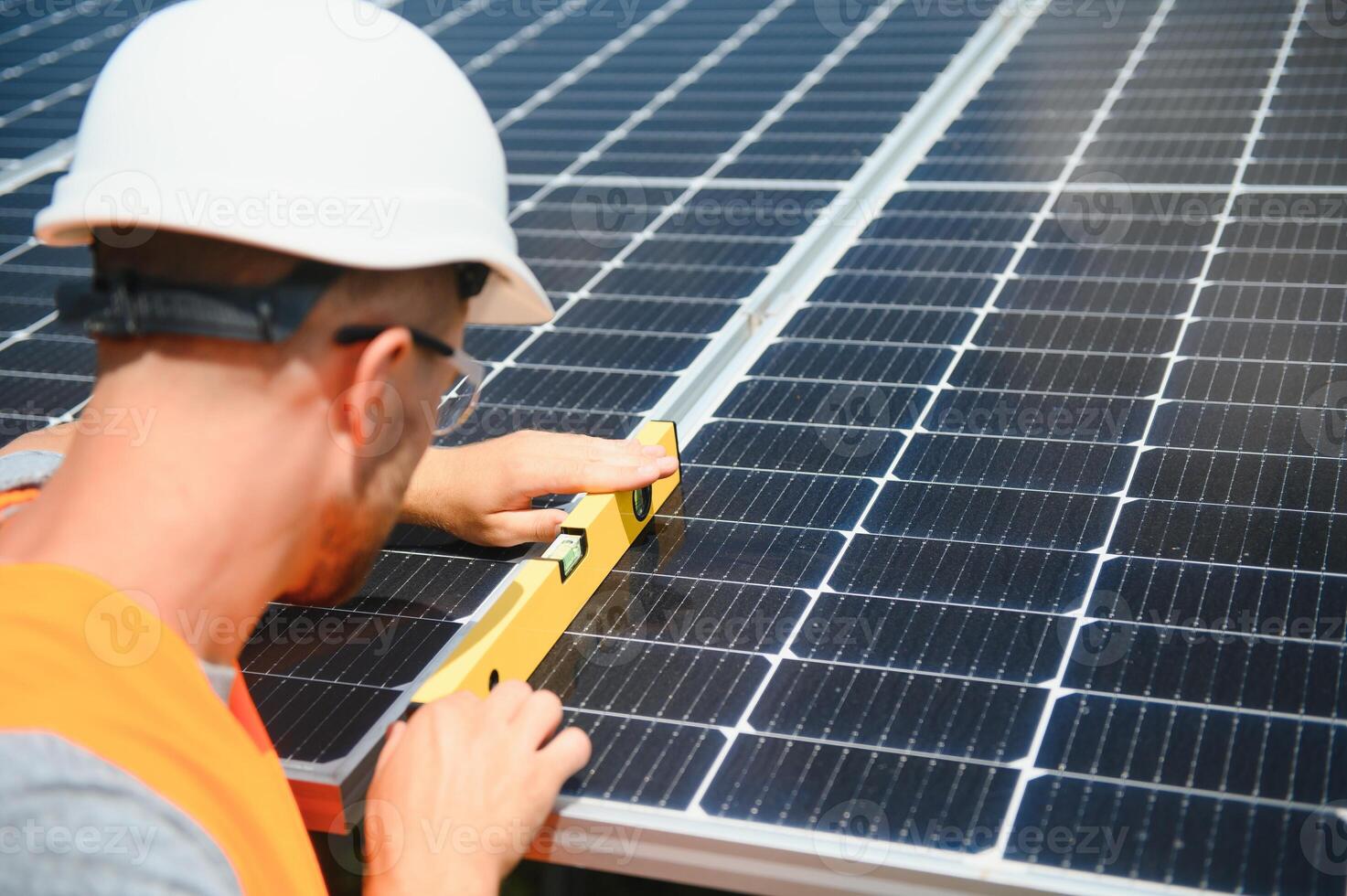 A man working at solar power station. photo