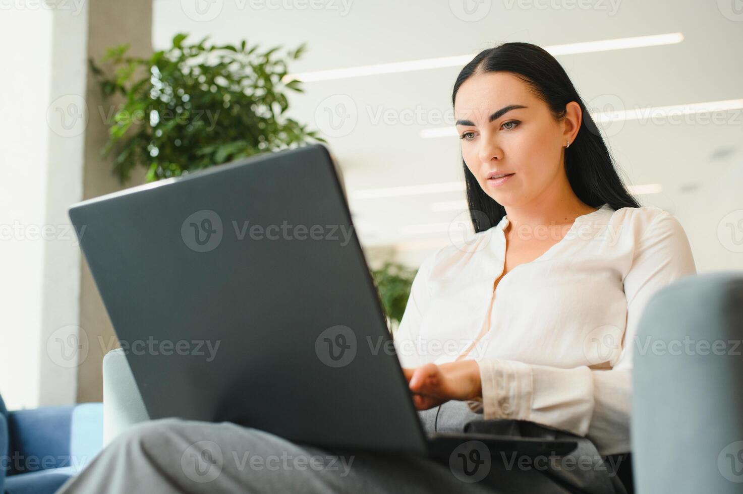 Portrait of skilled creative designer working on visualization great idea for interior making web model of outlay using application on laptop computer connected to 5G wireless in coworking office. photo