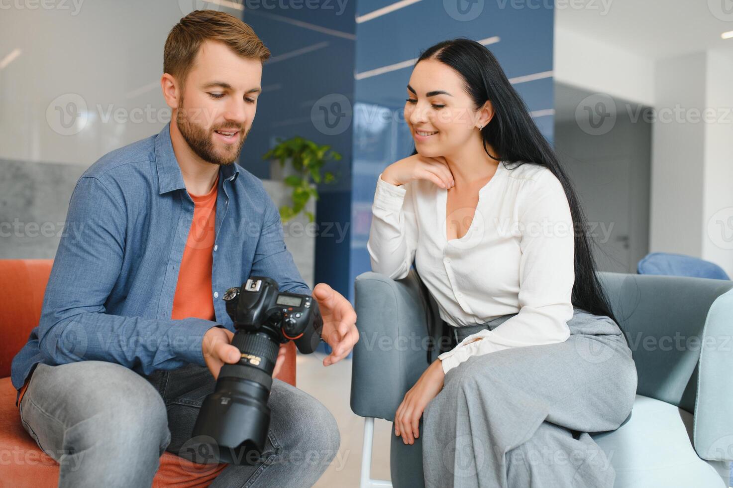Photographer communicates with the client in the office. photo