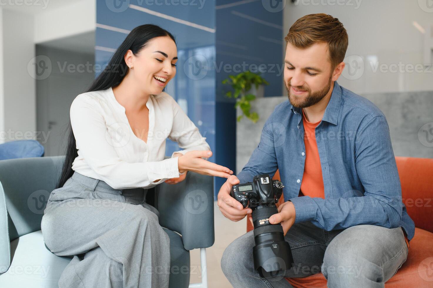 Photographer communicates with the client in the office. photo