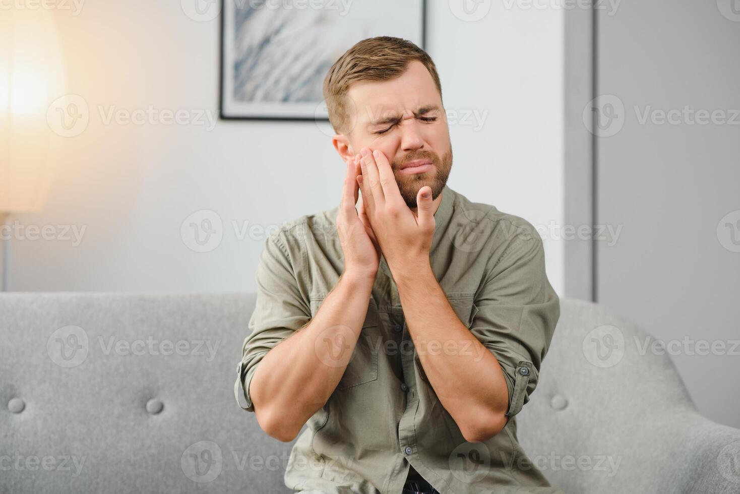 Man suffering from tooth ache in morning photo