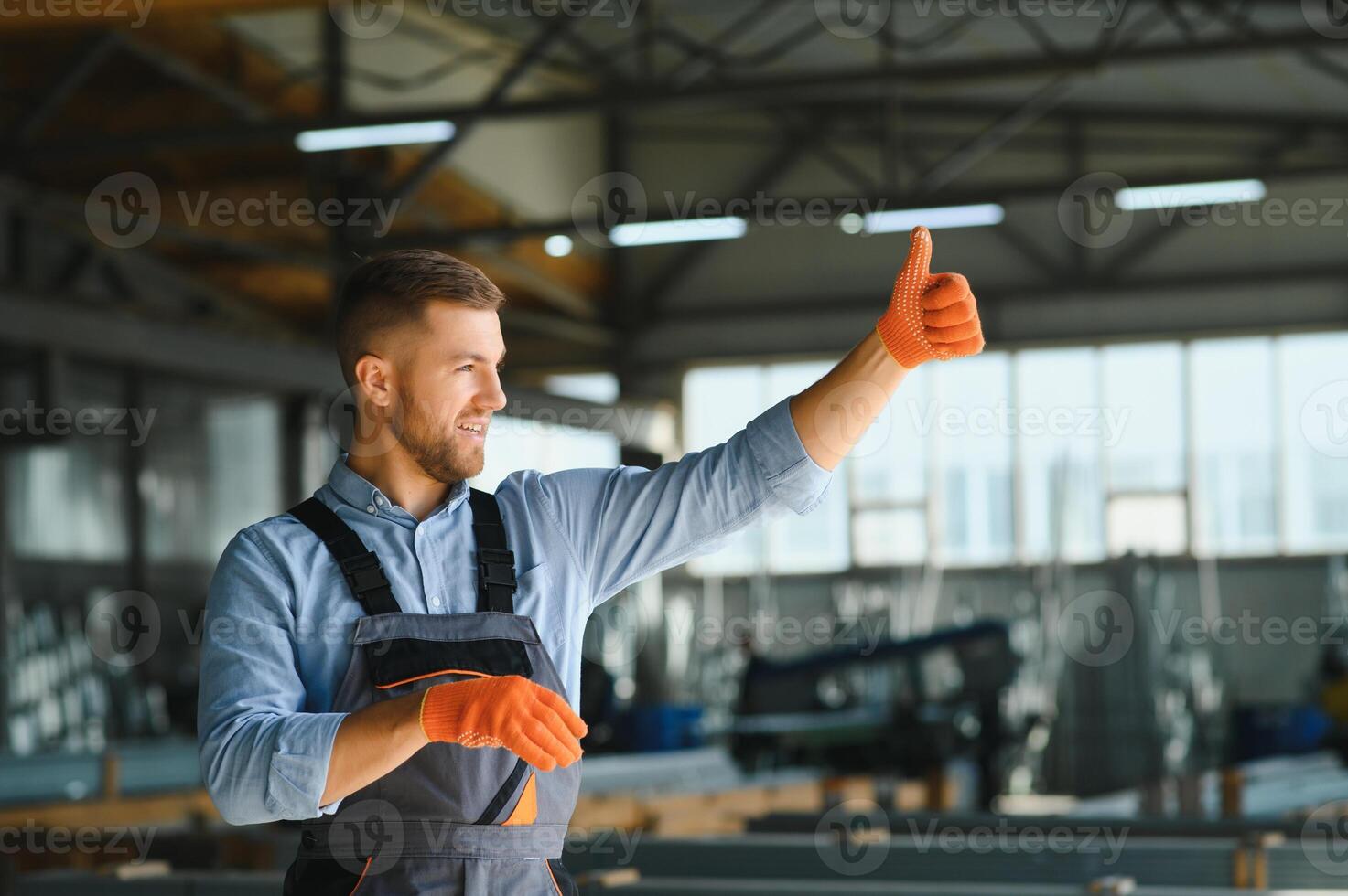 Portrait of factory worker. Young handsome factory worker. photo