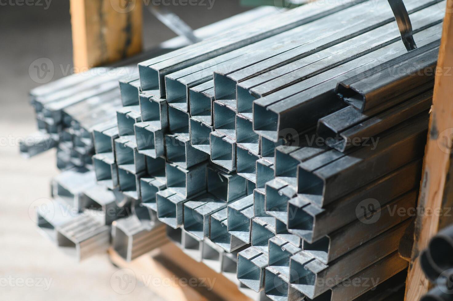 Stack of rolled metal products, perspective view of steel pipes of rectangular cross-section photo