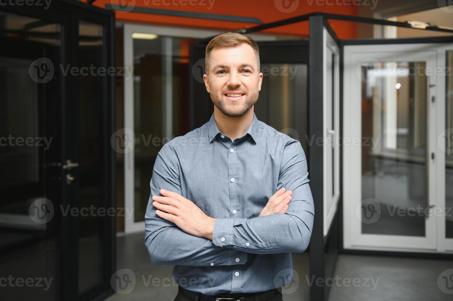 Friendly seller in window shop with keys. A large selection of windows and doors for the house. Home renovation concep photo