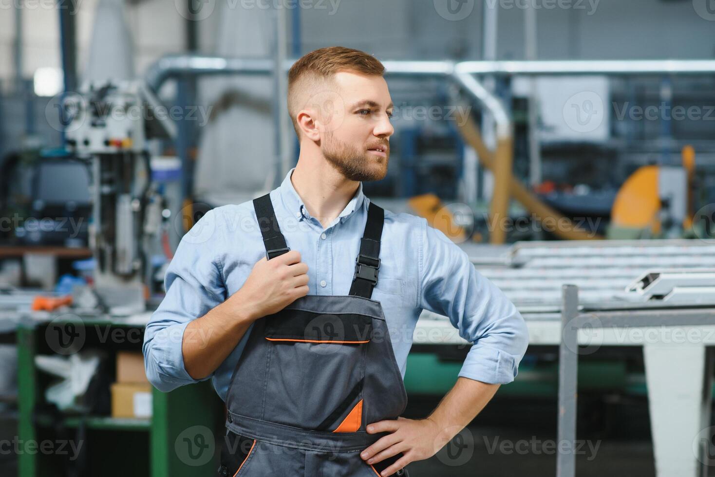 Factory for aluminum and PVC windows and doors production. Manual worker assembling PVC windows and doors photo