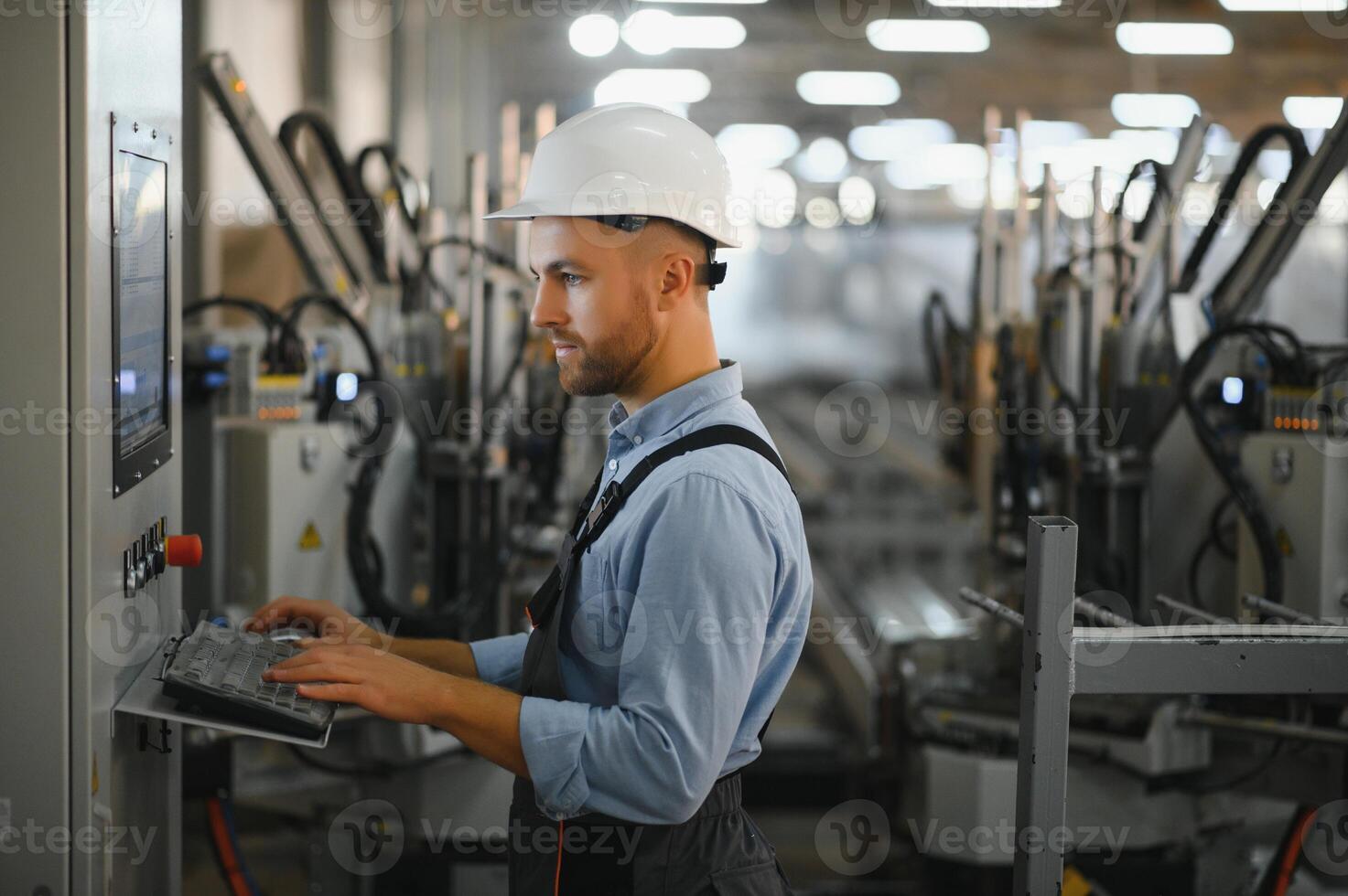 Factory for aluminum and PVC windows and doors production. Manual worker assembling PVC windows and doors. photo