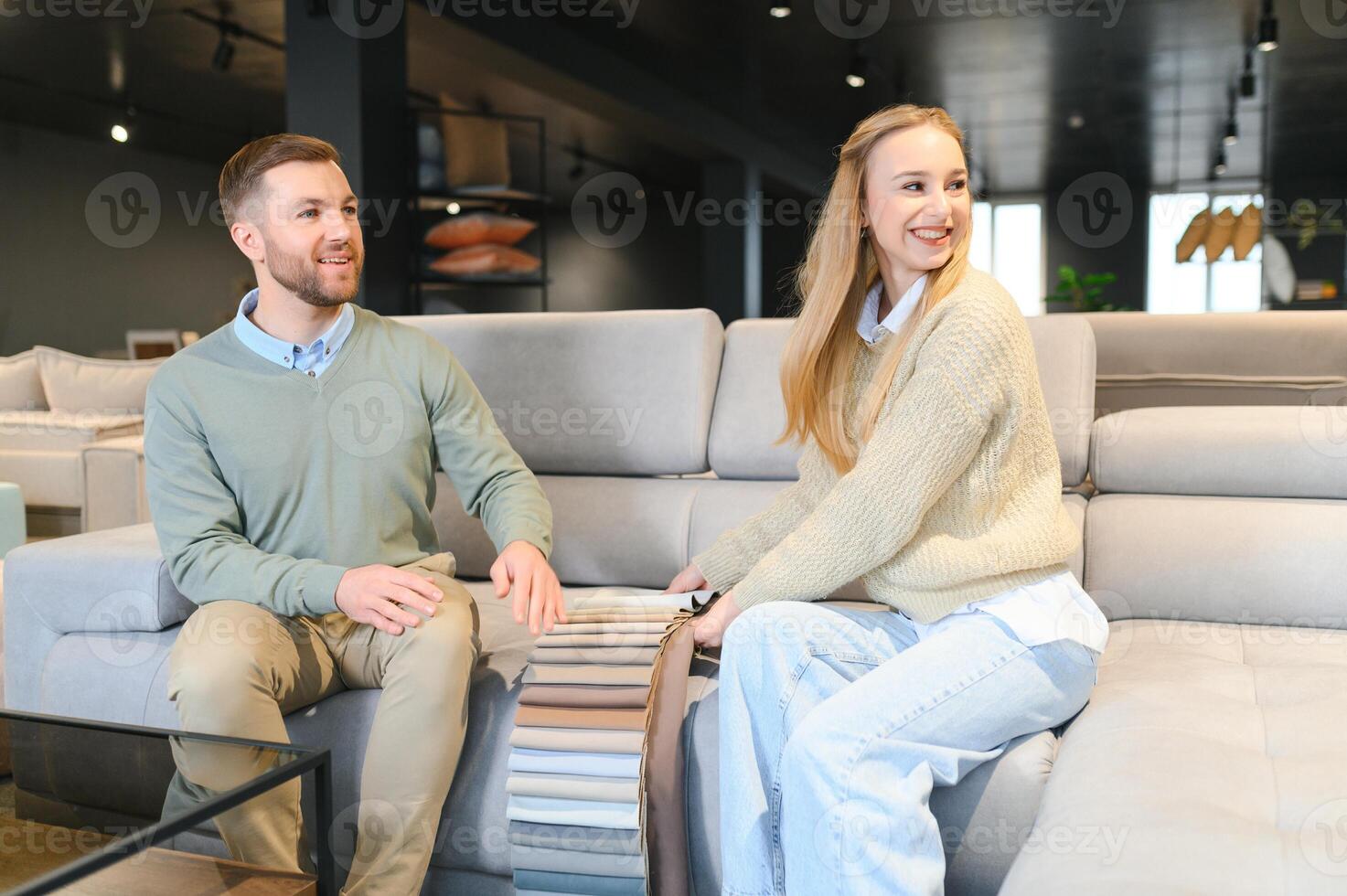 Married couple in the shop choosing furniture photo