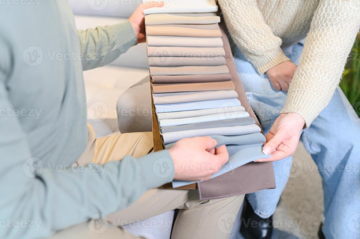 Happy couple choosing furniture in store photo