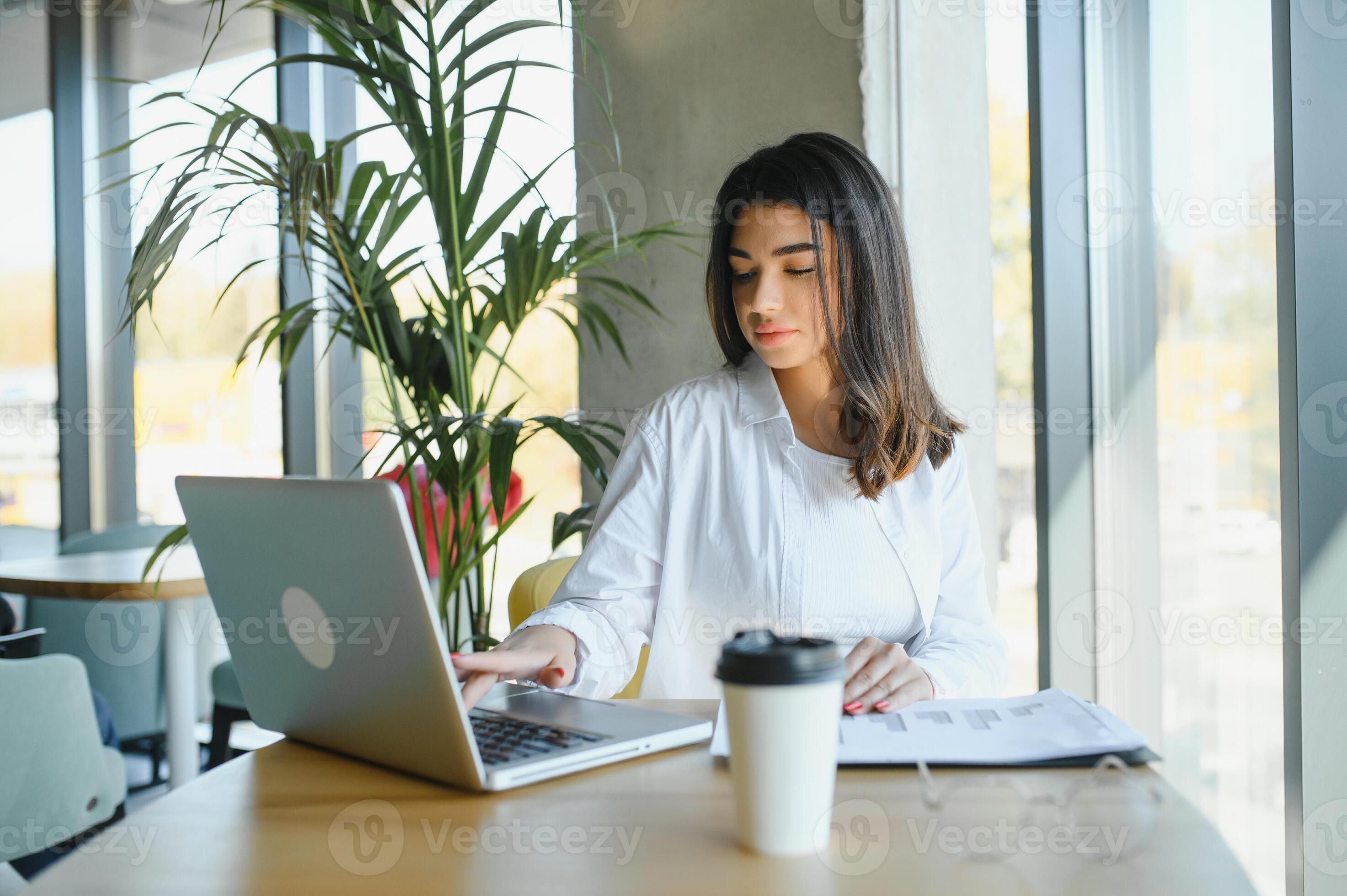 Smiling girl student study online with skype teacher happy young woman learn language listen lecture watch webinar write notes look at laptop sit in cafe distant education 46758314 Stock Photo at Vect...