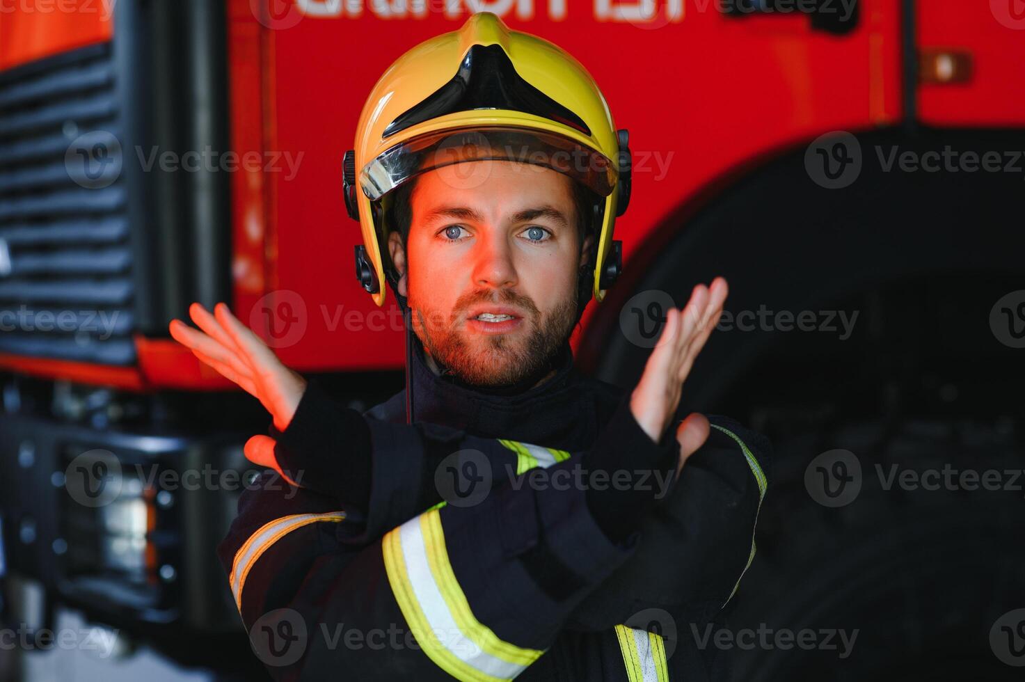 Photo of fireman with gas mask and helmet near fire engine