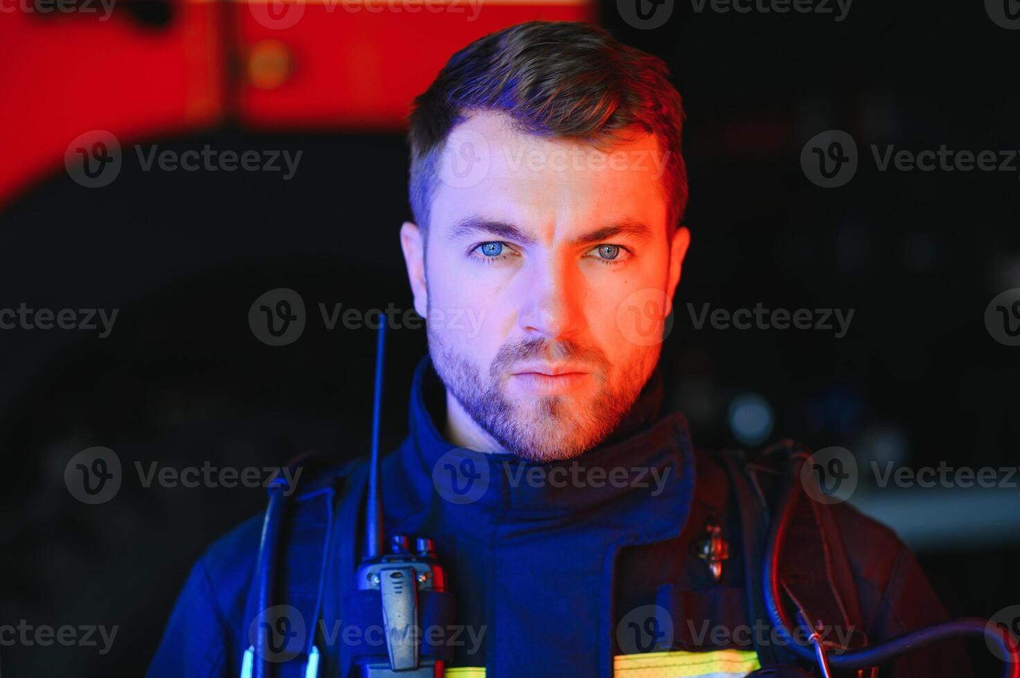 Portrait of police officers with serious faces looking at camera. FBI agent work at the scene at night. photo