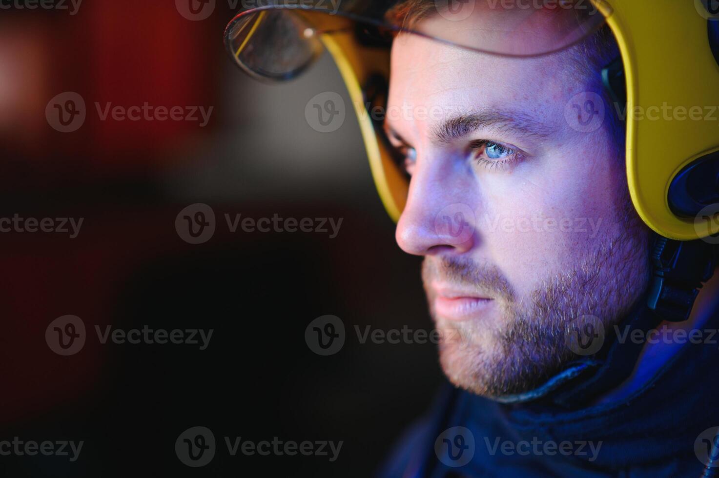 Firefighter portrait on duty. Photo fireman with gas mask and helmet near fire engine.