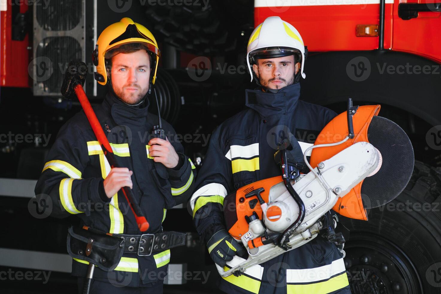 firemen leaving the station equipped and with the tools for the extinction of the fire photo