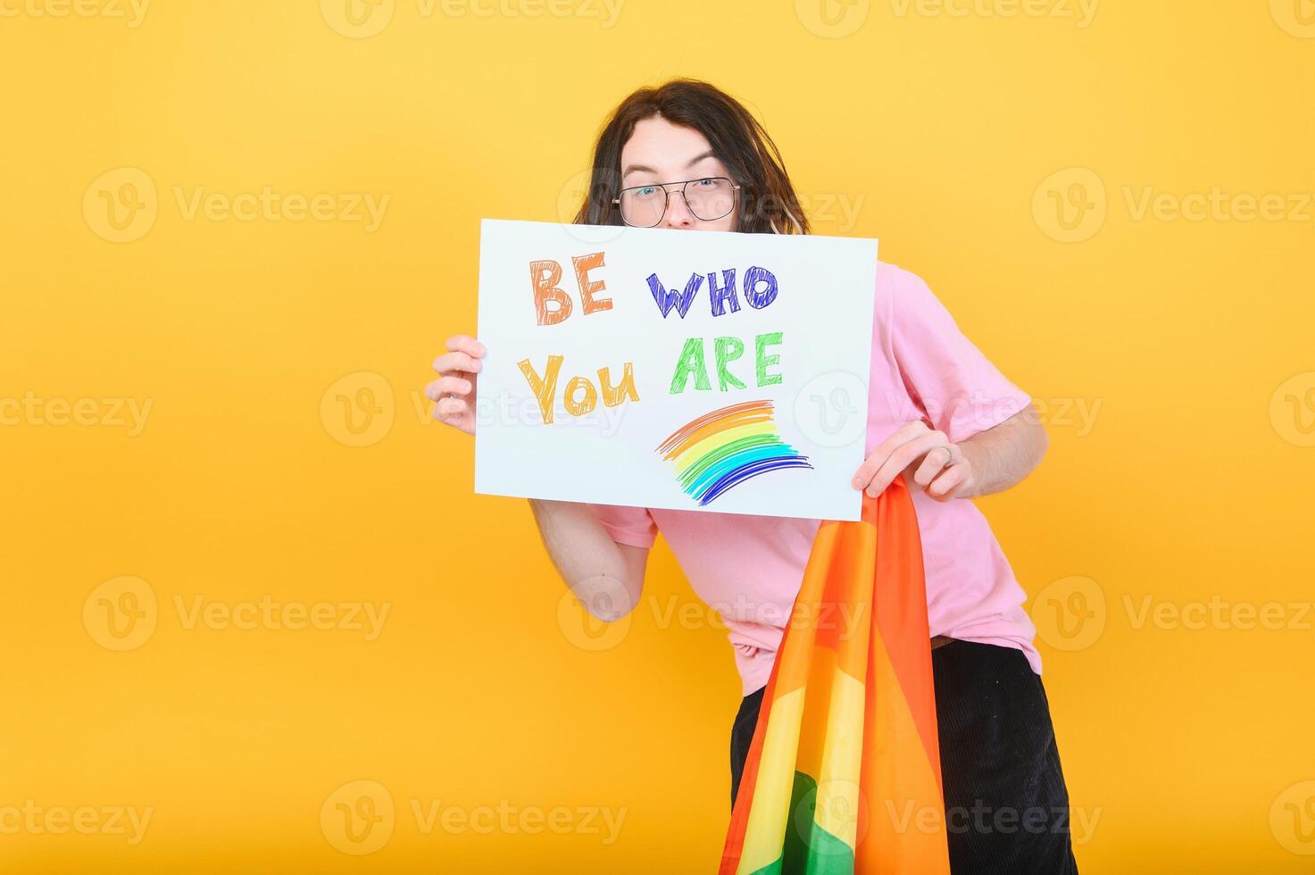Portrait of a gay man on a colored background. Gender equality. The concept of the LGBT community. Equality. photo