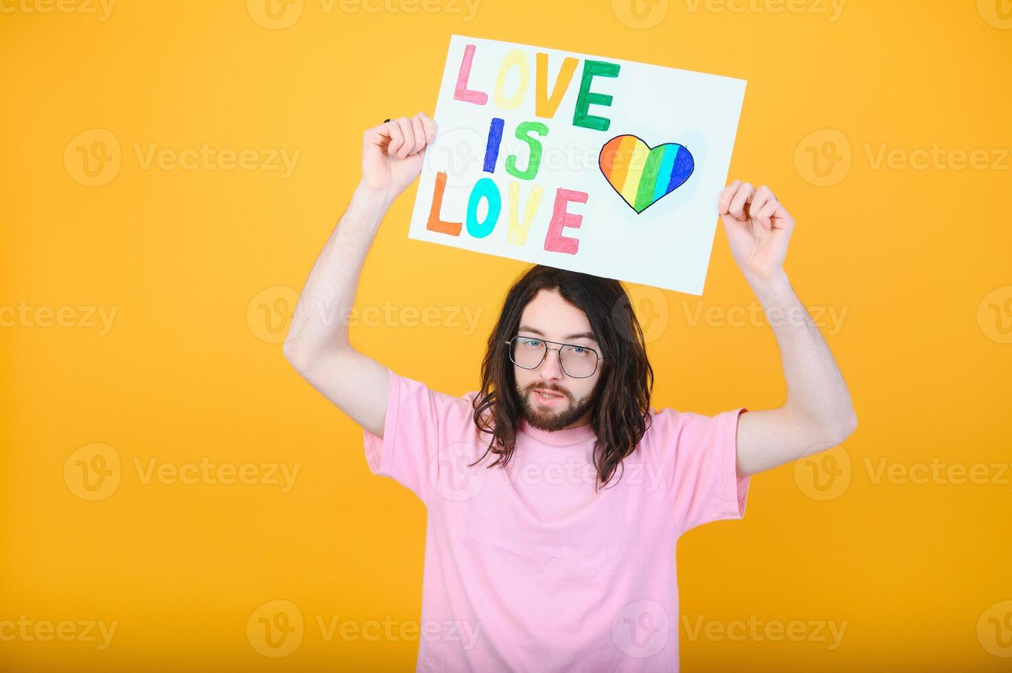 Portrait of a gay man on a colored background. Gender equality. The concept of the LGBT community. Equality. photo