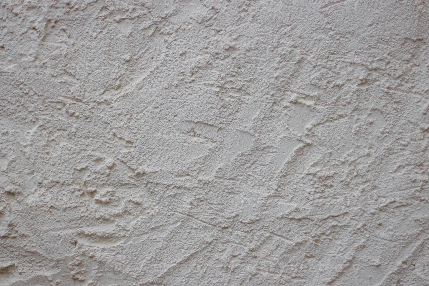 Wall fragment with scratches and cracks. Concrete cement wall texture with three dimensional elements. Modern design. Retro grunge style. Copy space. Wallpaper, banner, textures, background photo
