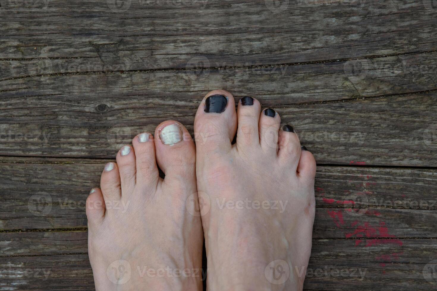 Female foot barefoot white pearlmutt nail polish hanging above water. Resting at the lake, sitting on the river beach. Relaxing at nature. Sky reflection. Vacation mood. Happy summer day. Top view photo