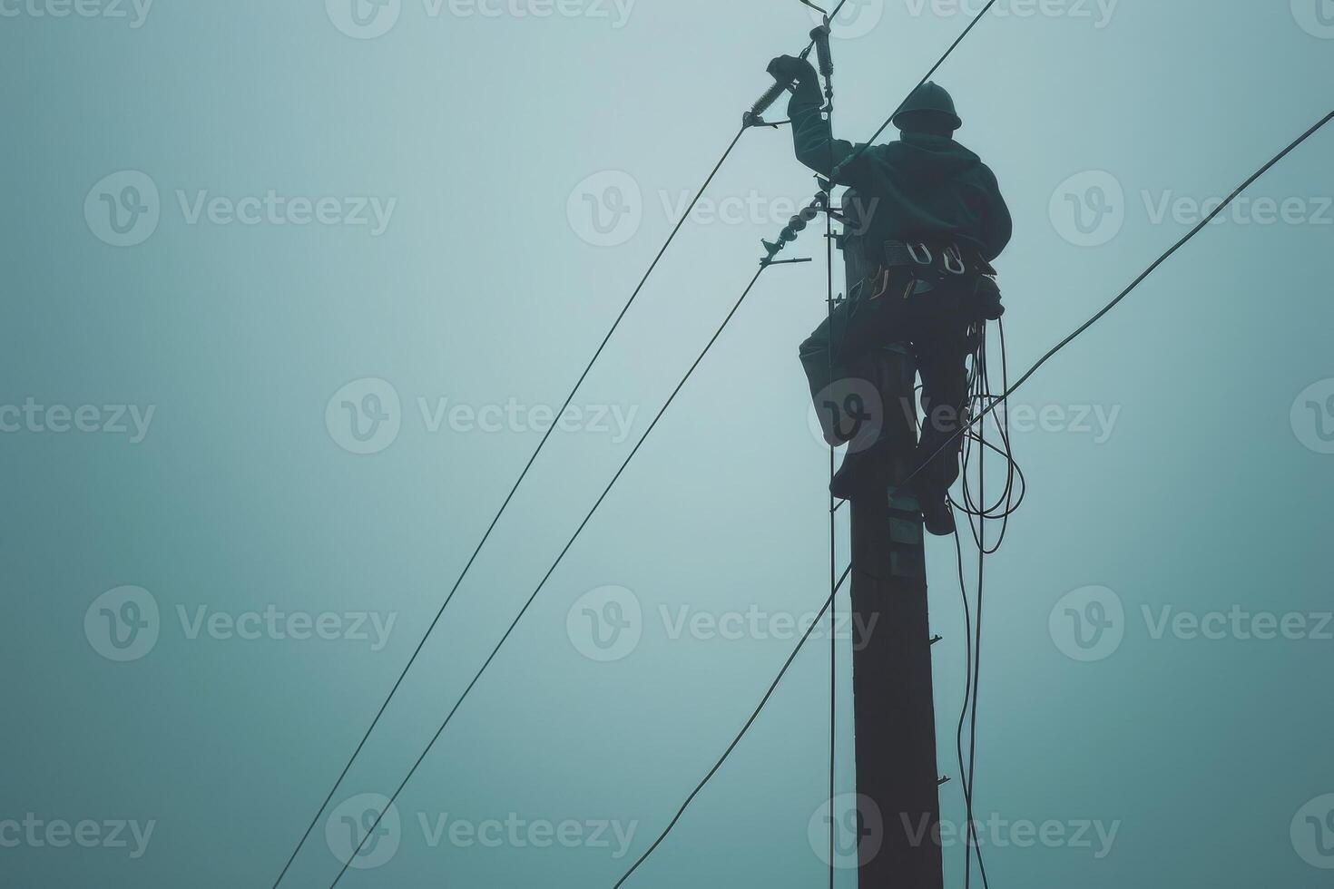 Electrician Working on a Power Pole photo
