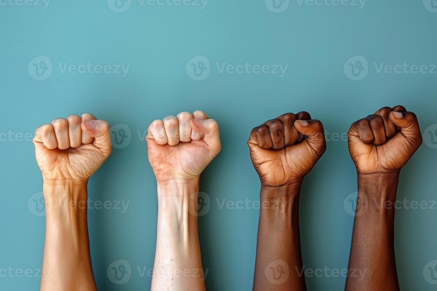 Fists Raised In Unity Against Black Background photo