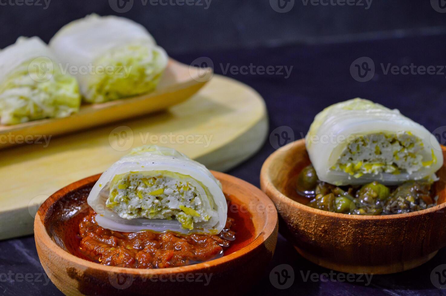 Sawi gulung tahu or rolled Chinese cabbage with tofu. Served with red chilli sauce and green chilli sauce. photo