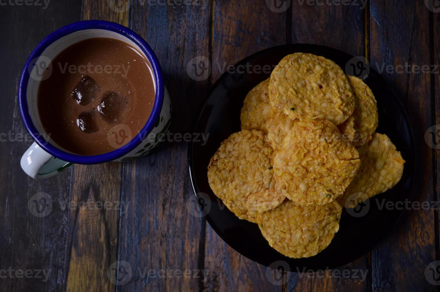 Tempeh chips are a food made from tempeh which is thinly sliced and then fried using seasoned flour. Usually the taste is salty with a savory onion aroma. photo