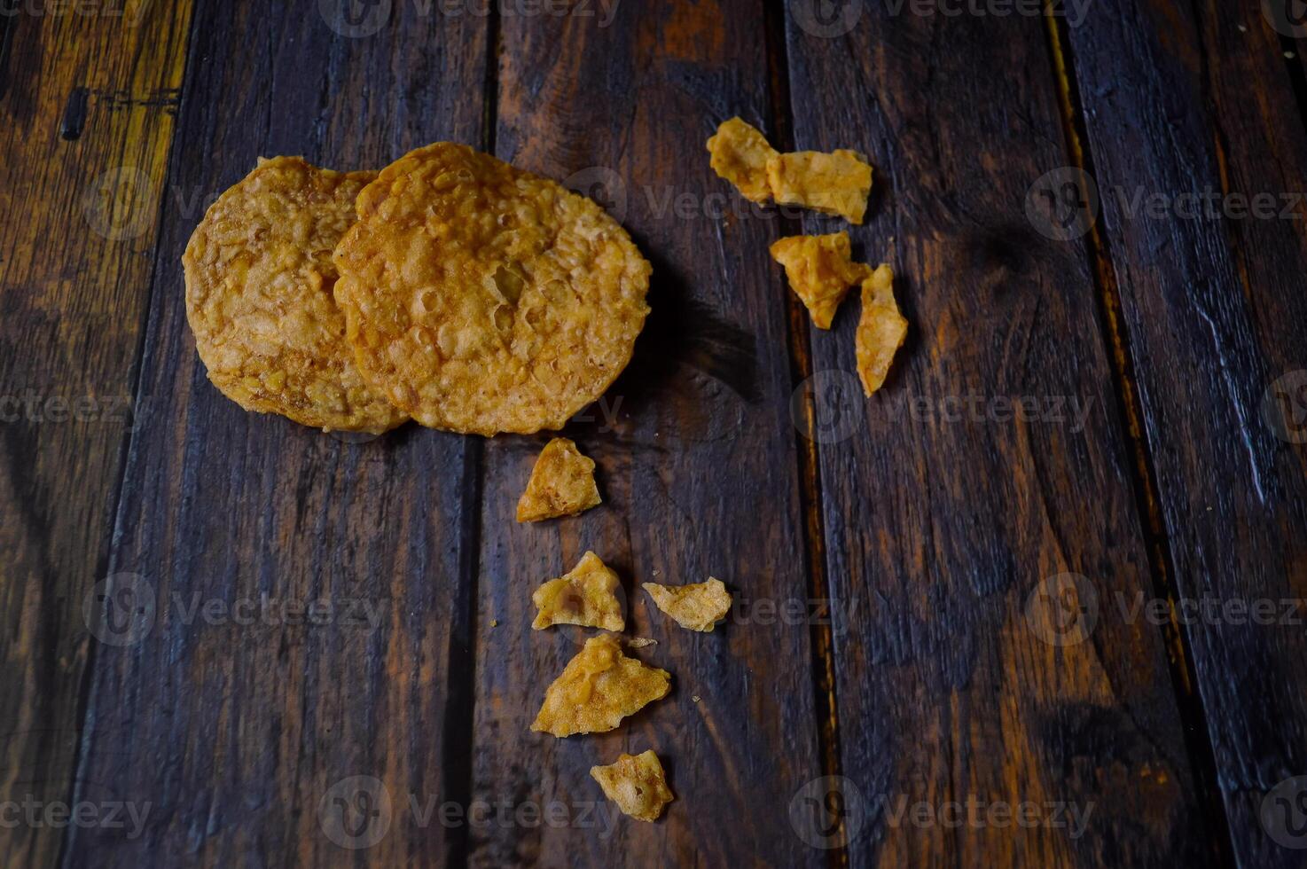 Tempeh chips are a food made from tempeh which is thinly sliced and then fried using seasoned flour. Usually the taste is salty with a savory onion aroma. photo