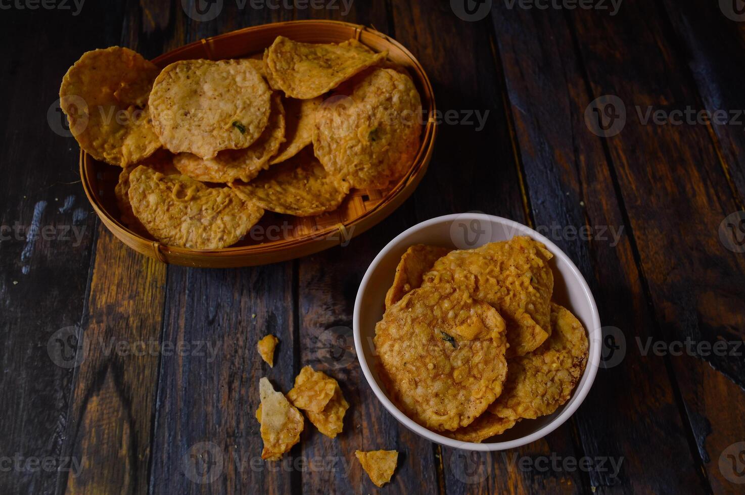 Tempeh chips are a food made from tempeh which is thinly sliced and then fried using seasoned flour. Usually the taste is salty with a savory onion aroma. photo