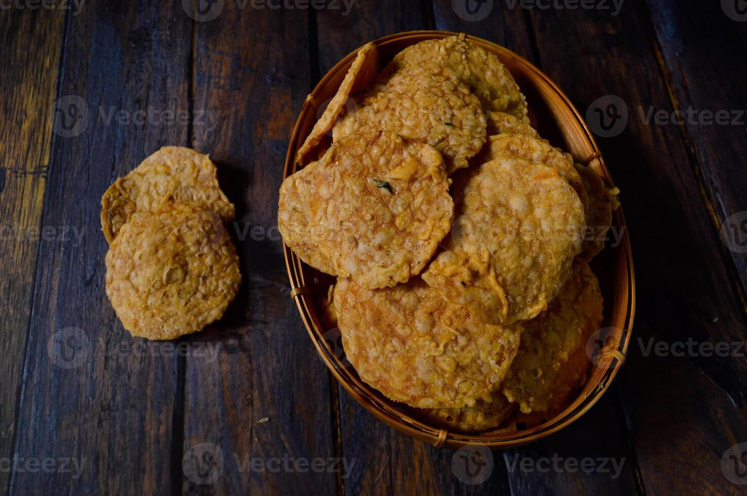 Tempeh chips are a food made from tempeh which is thinly sliced and then fried using seasoned flour. Usually the taste is salty with a savory onion aroma. photo
