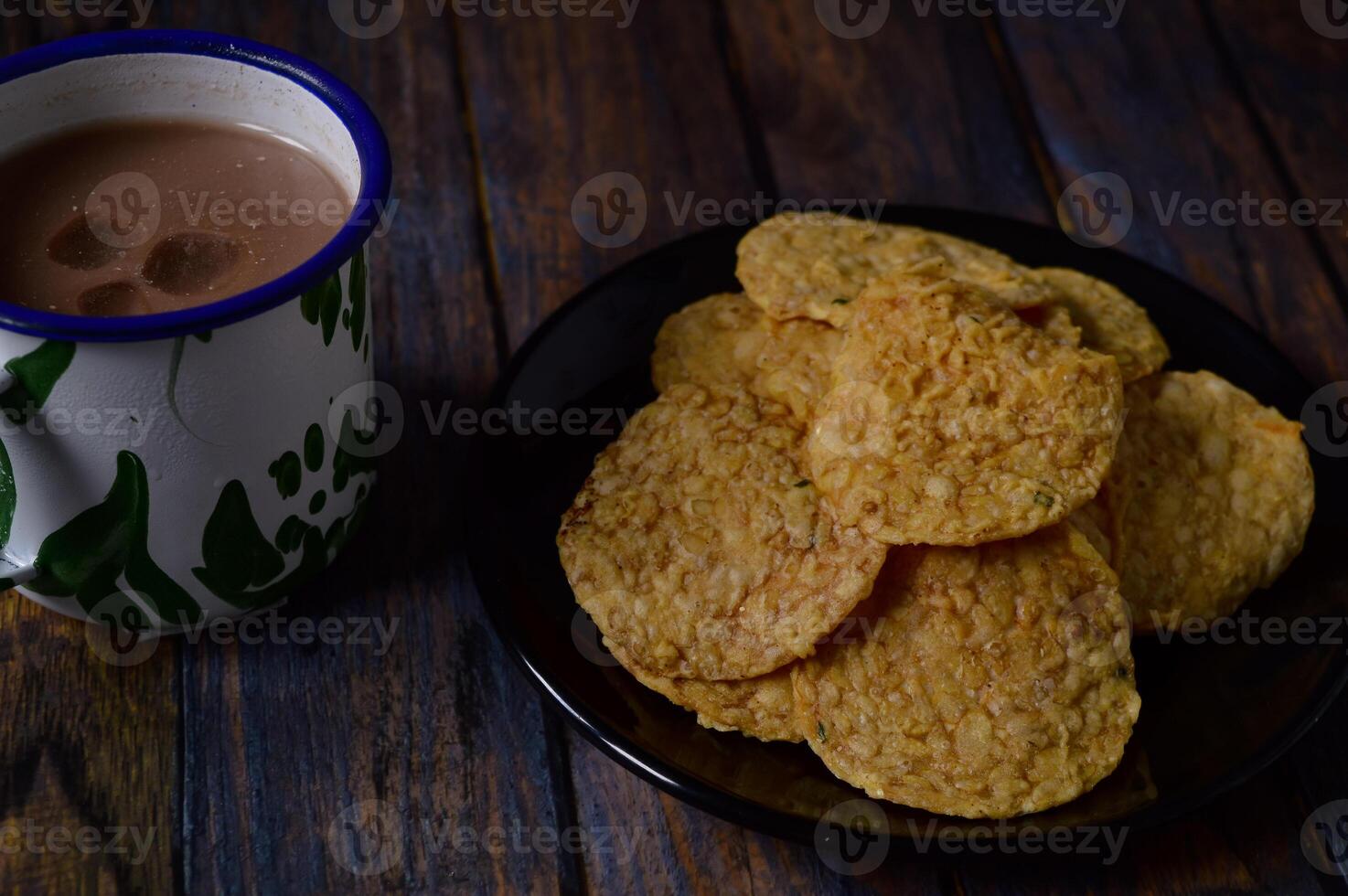Tempeh chips are a food made from tempeh which is thinly sliced and then fried using seasoned flour. Usually the taste is salty with a savory onion aroma. photo