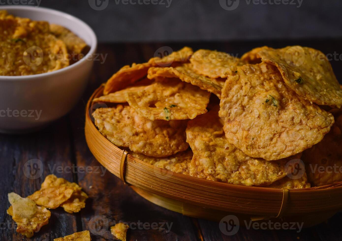 Tempeh chips are a food made from tempeh which is thinly sliced and then fried using seasoned flour. Usually the taste is salty with a savory onion aroma. photo
