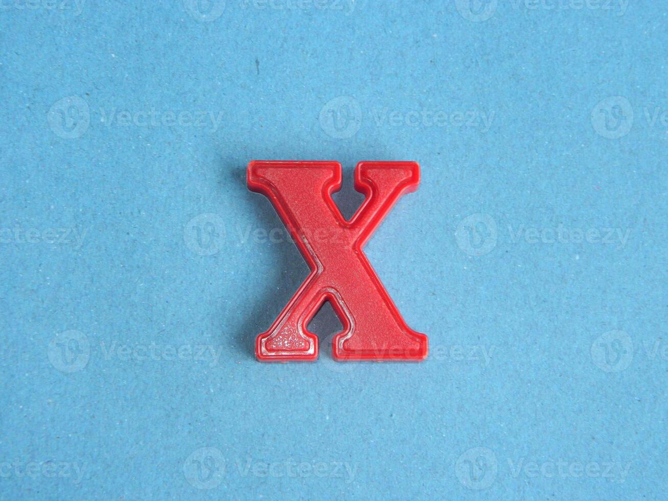 Macro photo or closeup photo of the alphabet from children's toys on a blue background. Use on preschool also