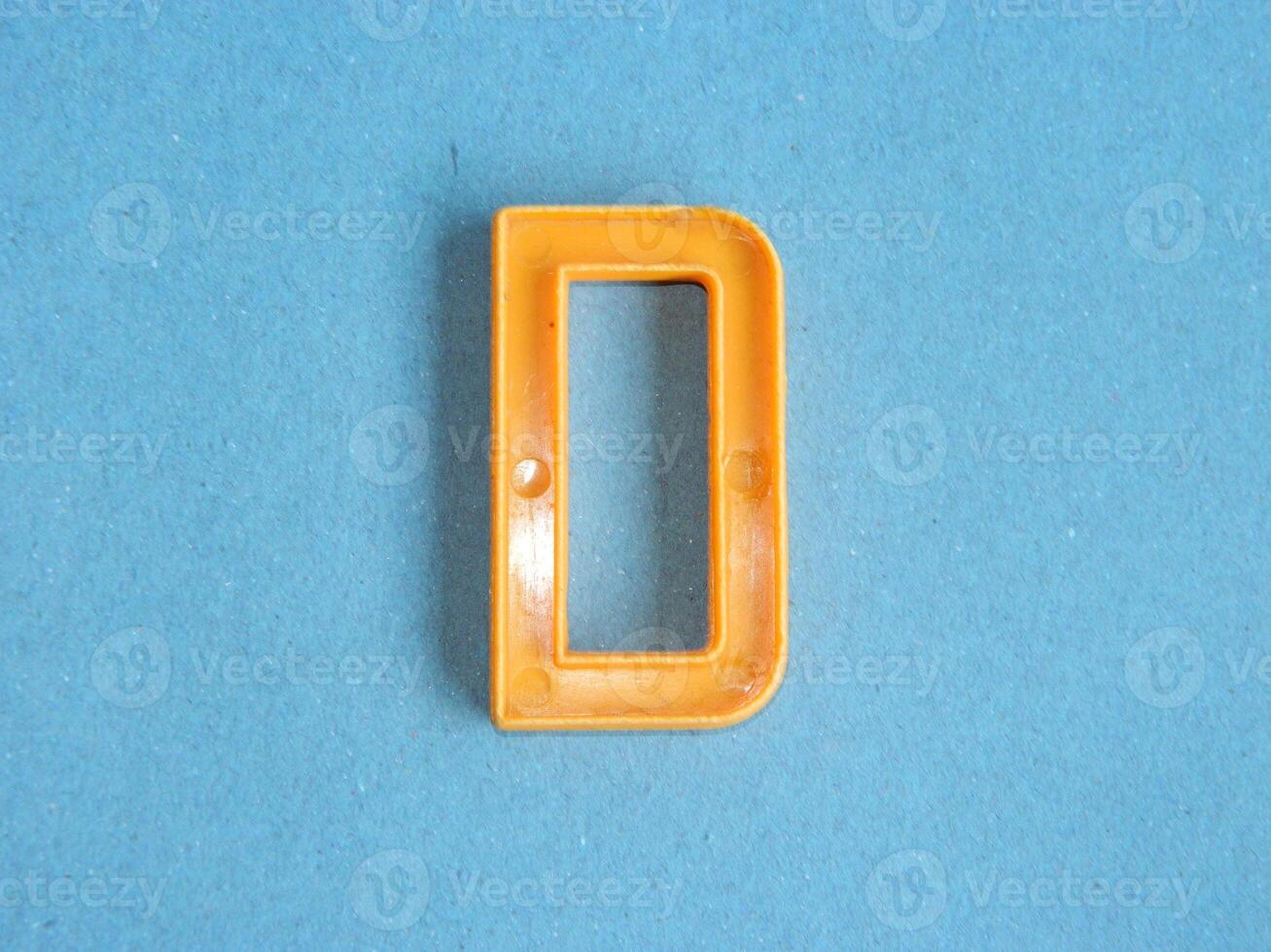 Macro photo or closeup photo of the alphabet from children's toys on a blue background. Use on preschool also