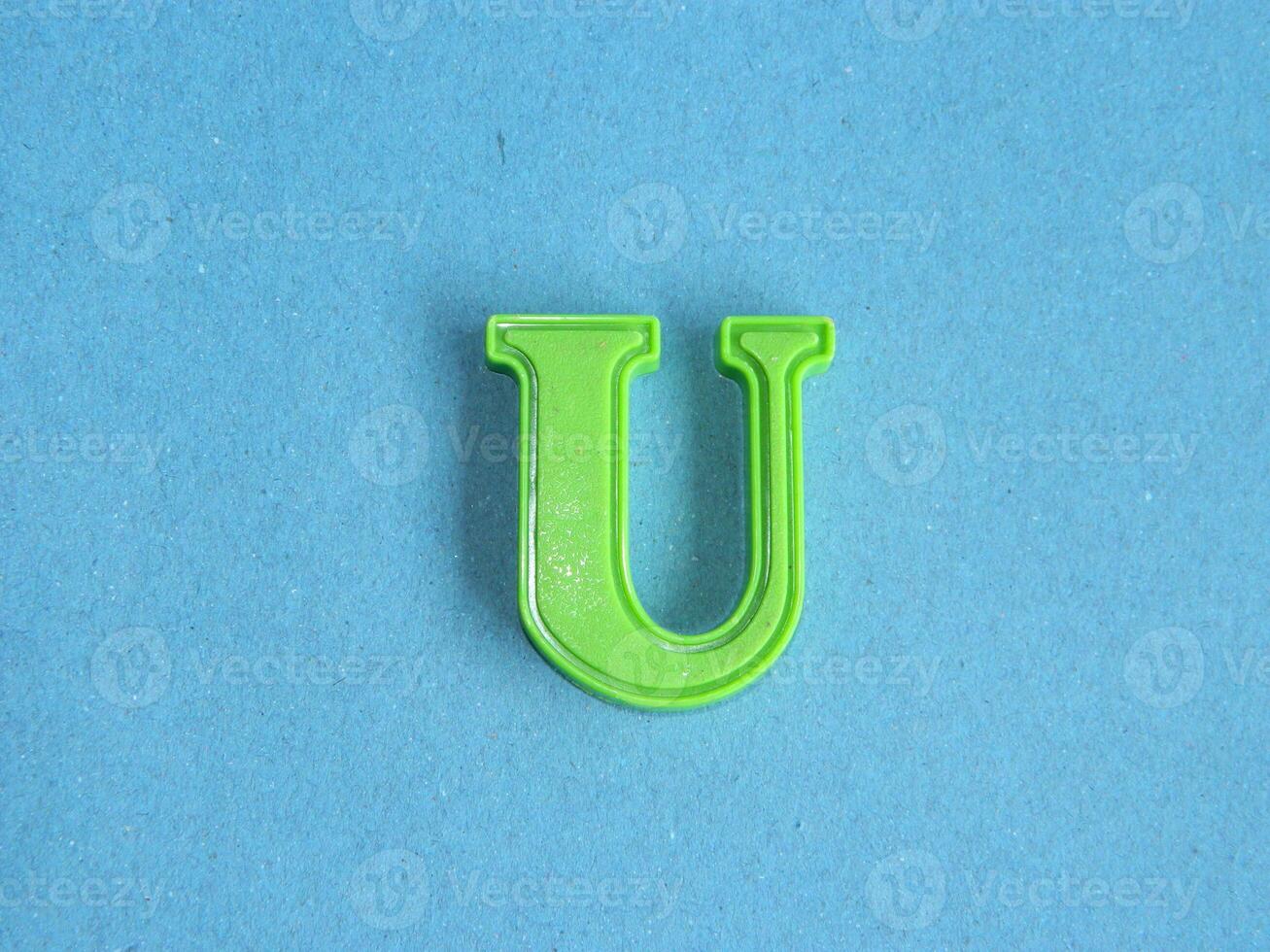 Macro photo or closeup photo of the alphabet from children's toys on a blue background. Use on preschool also