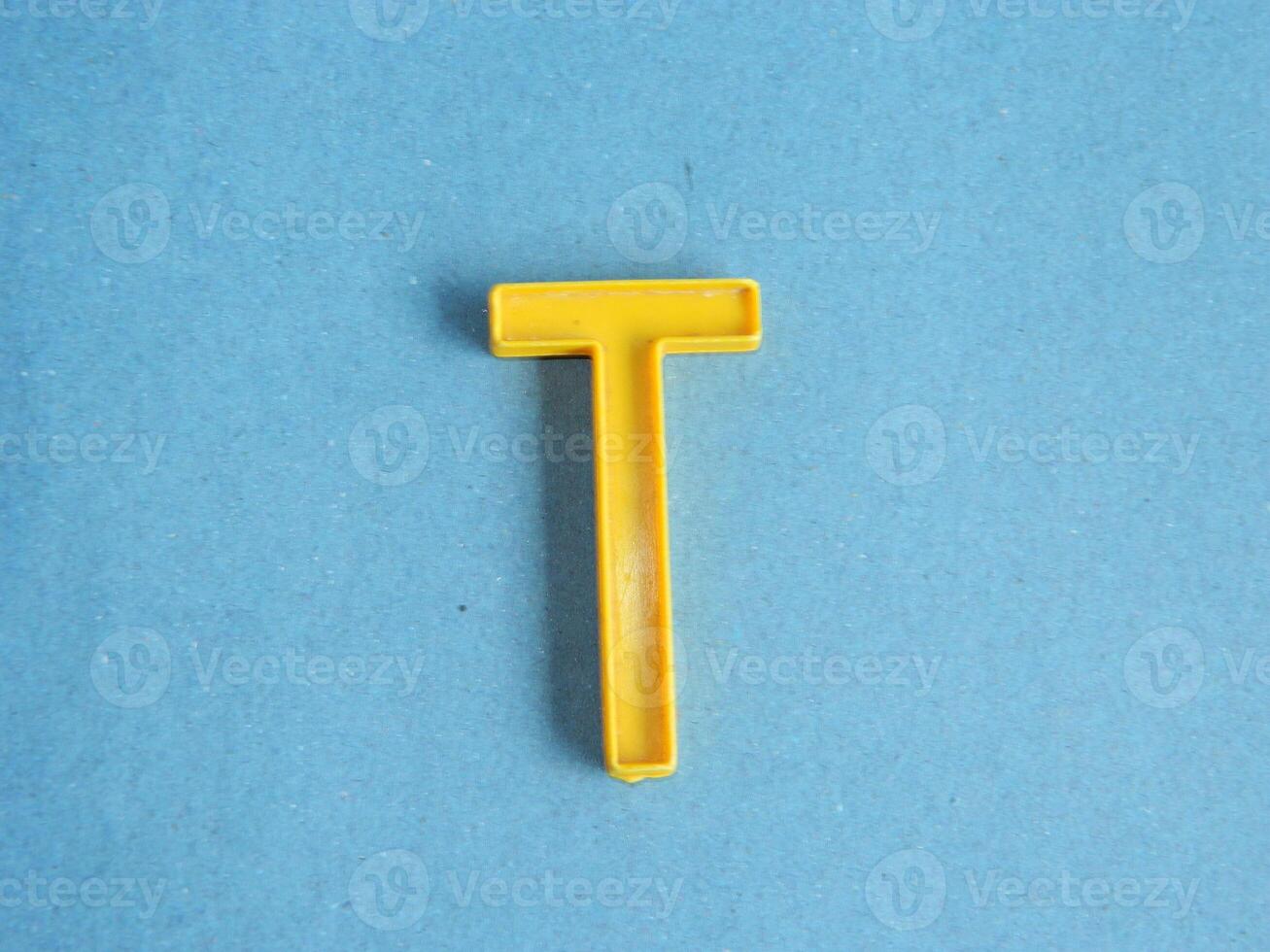 Macro photo or closeup photo of the alphabet from children's toys on a blue background. Use on preschool also