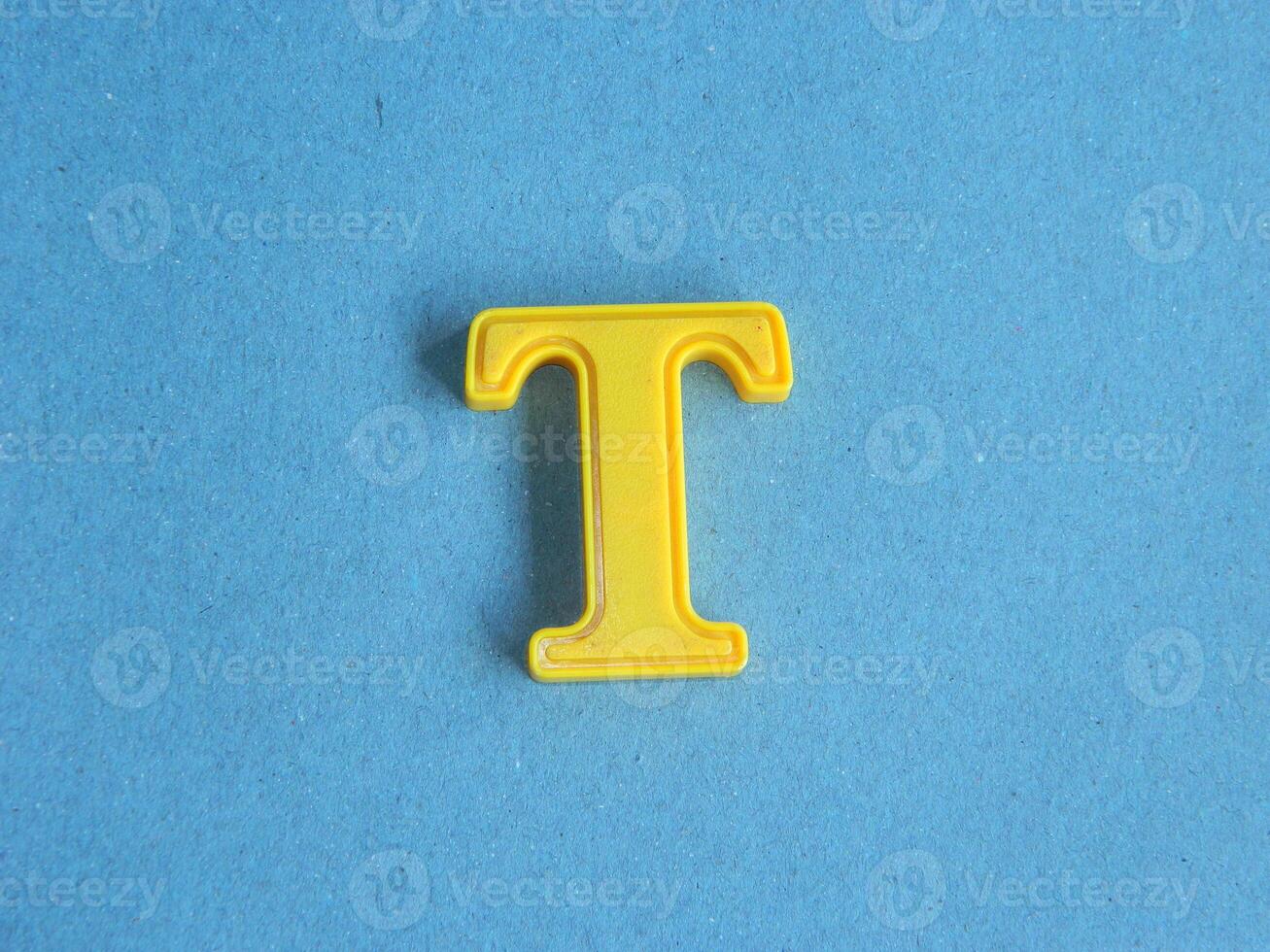 Macro photo or closeup photo of the alphabet from children's toys on a blue background. Use on preschool also