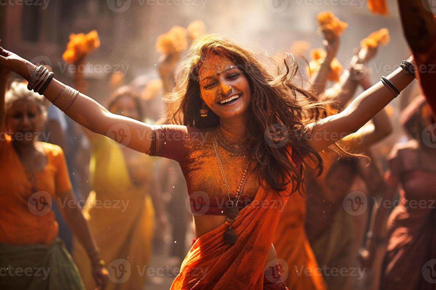 Beautiful Indian women's dancing in street, Holi holiday photo