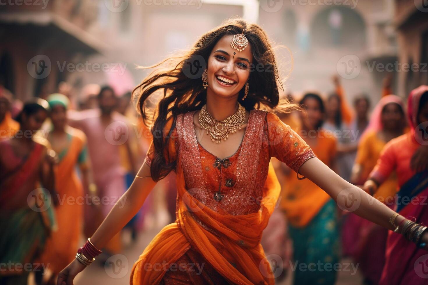 Beautiful Indian women's dancing in street, Holi holiday photo