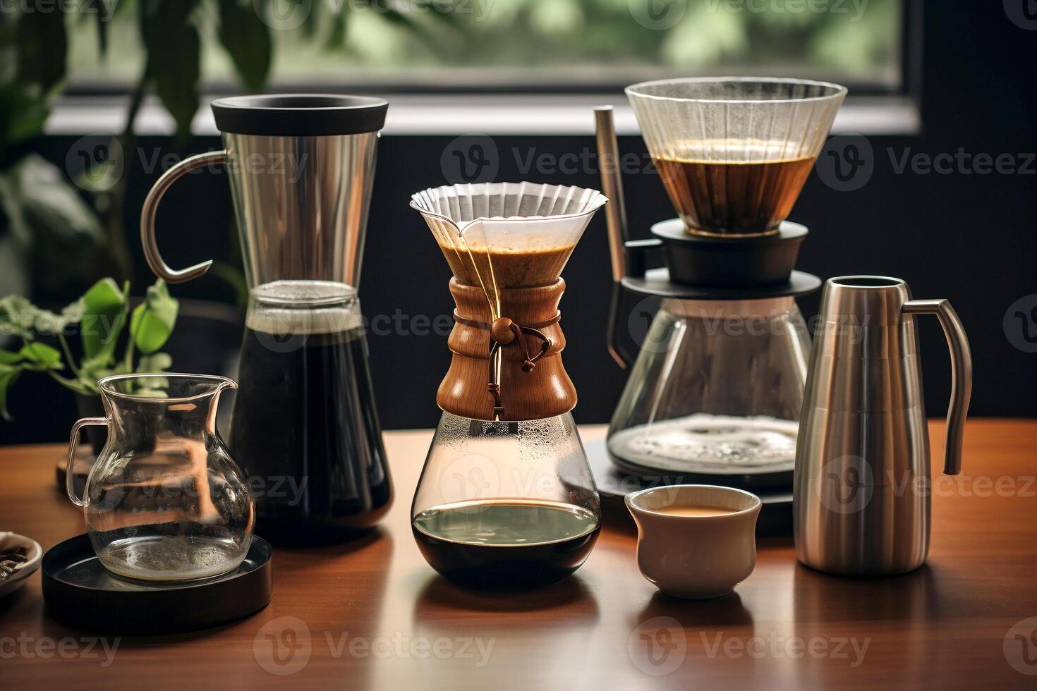 Coffee making equipment and tools at home kitchens to brew hot coffee that drips into cups photo