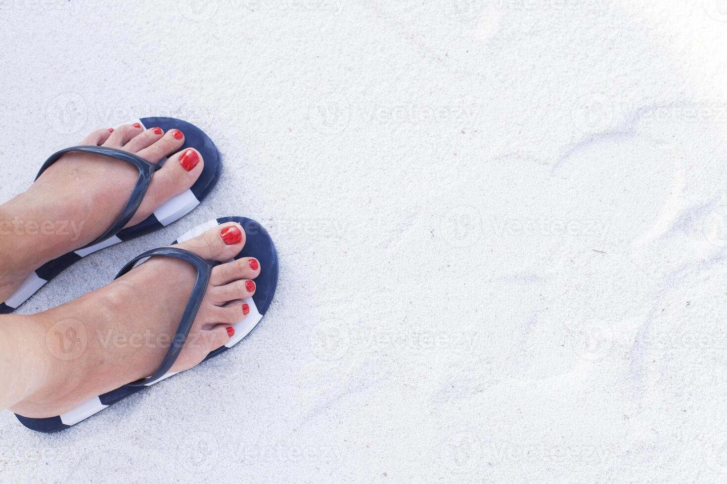 Female feet on sand photo