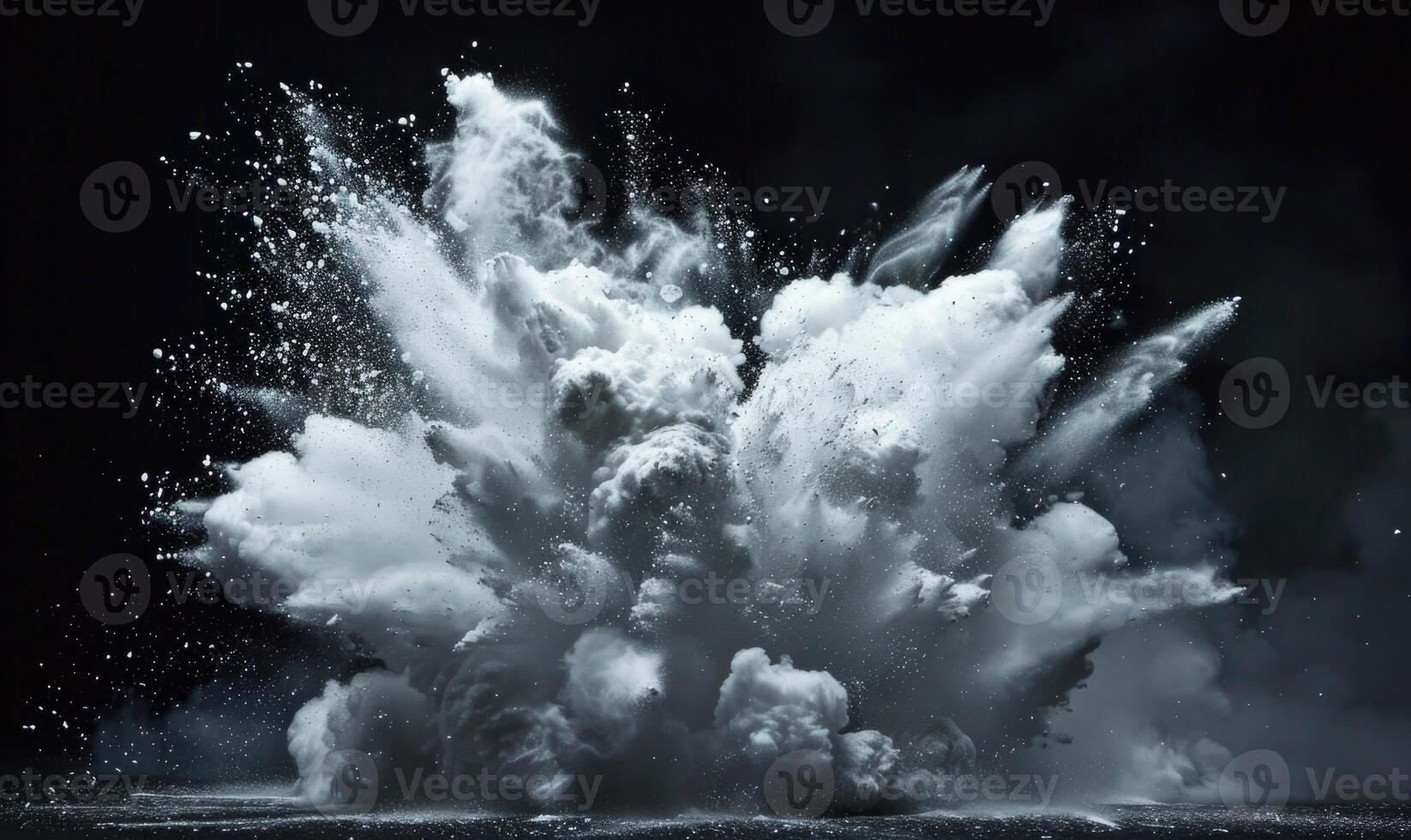 Powder explosion creating a white cloud on black background photo