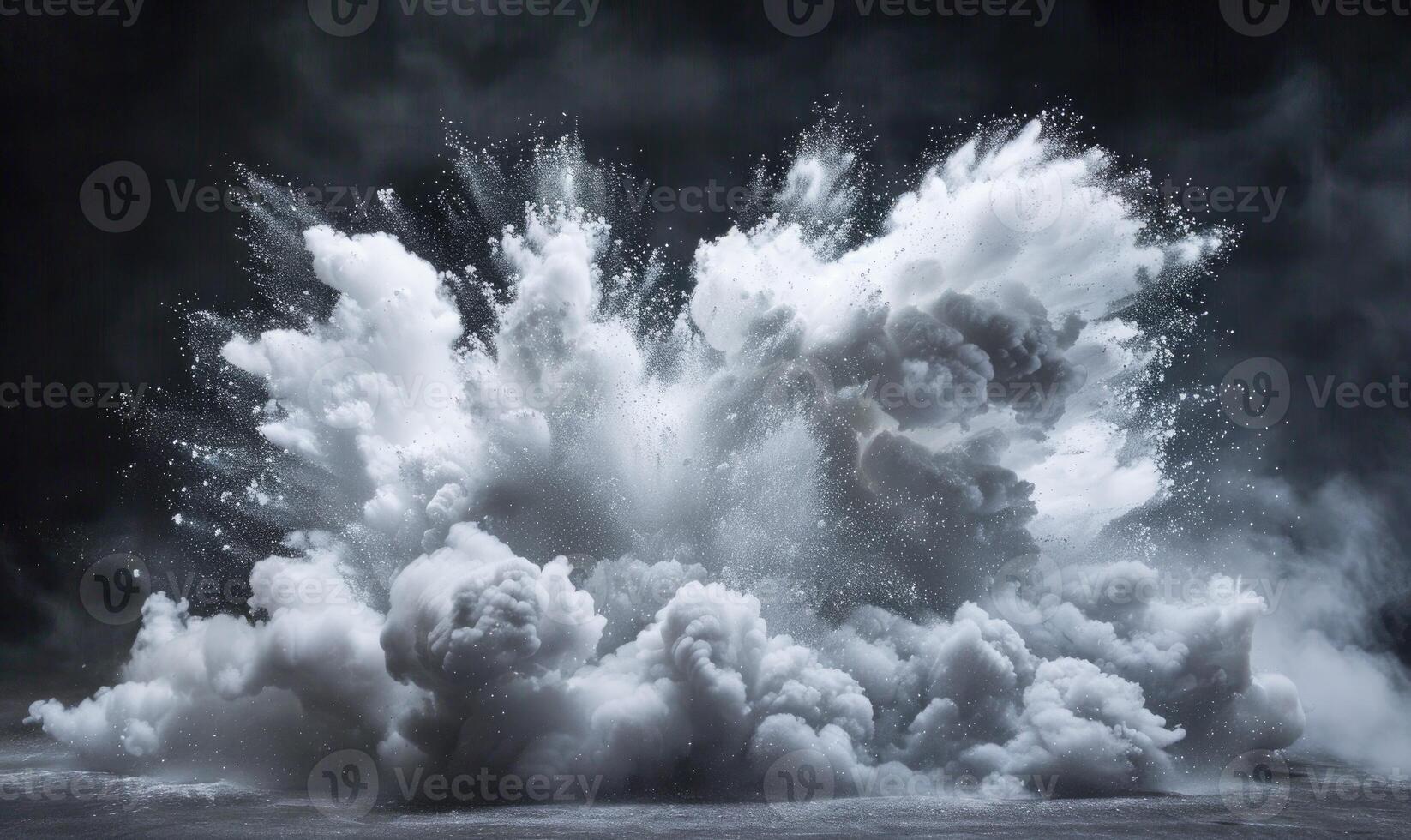 Powder explosion creating a white cloud on black background photo