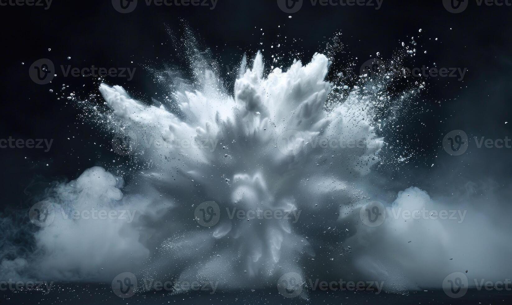 Powder explosion creating a white cloud on black background photo
