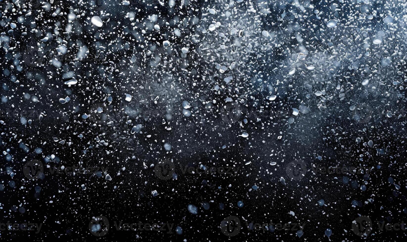 Snow explosion on black background photo