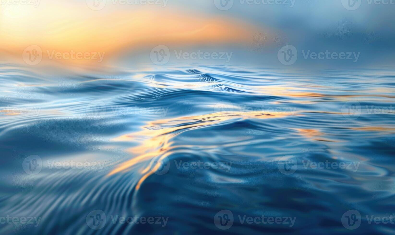 Closeup view on sea water surface with small waves and sun light on it photo