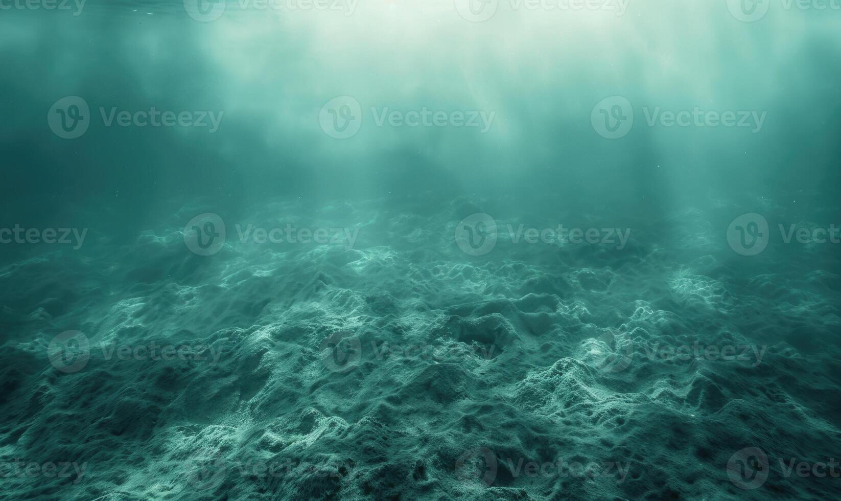 underwater scene with sun rays and seafloor photo