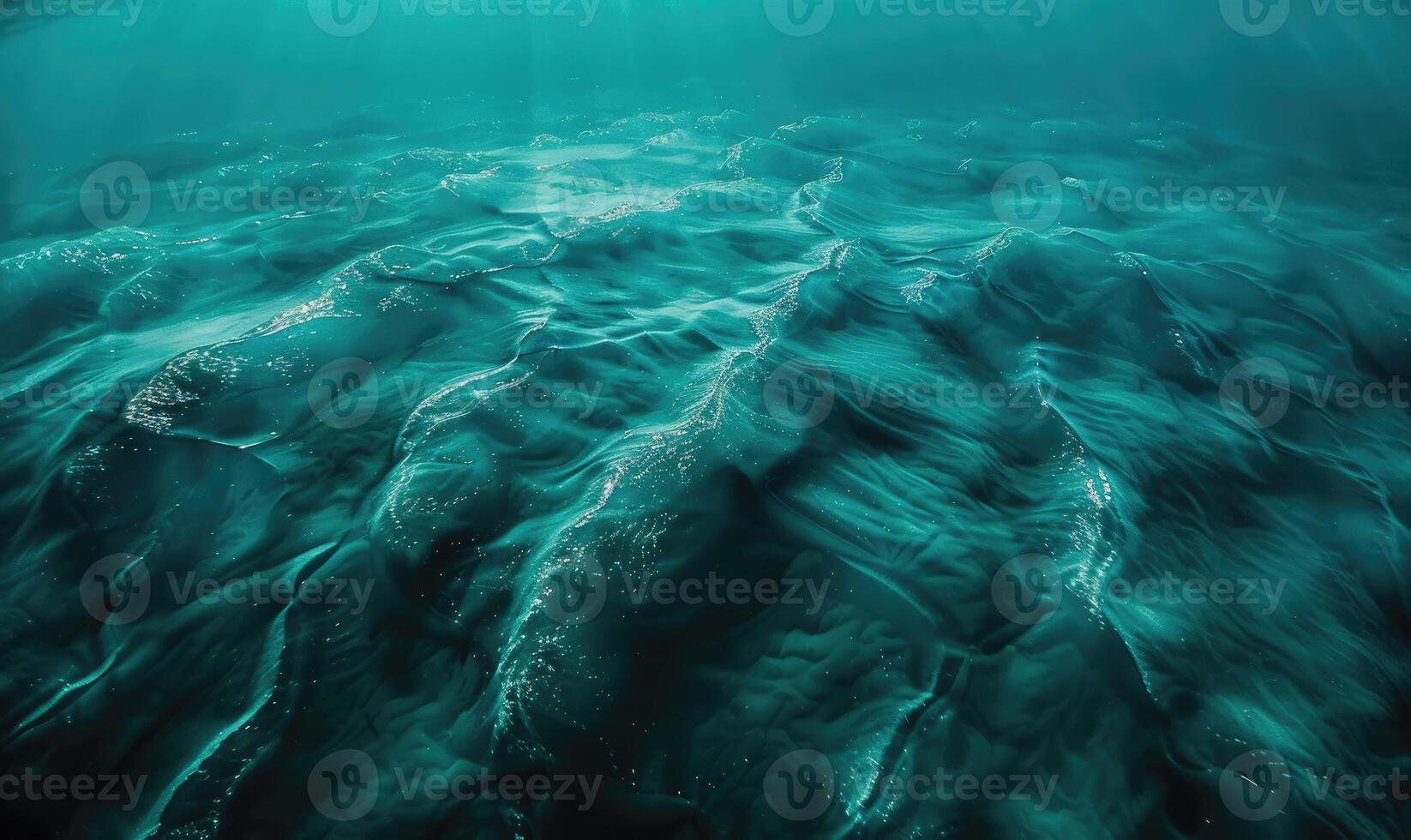 underwater scene with sun rays and seafloor photo