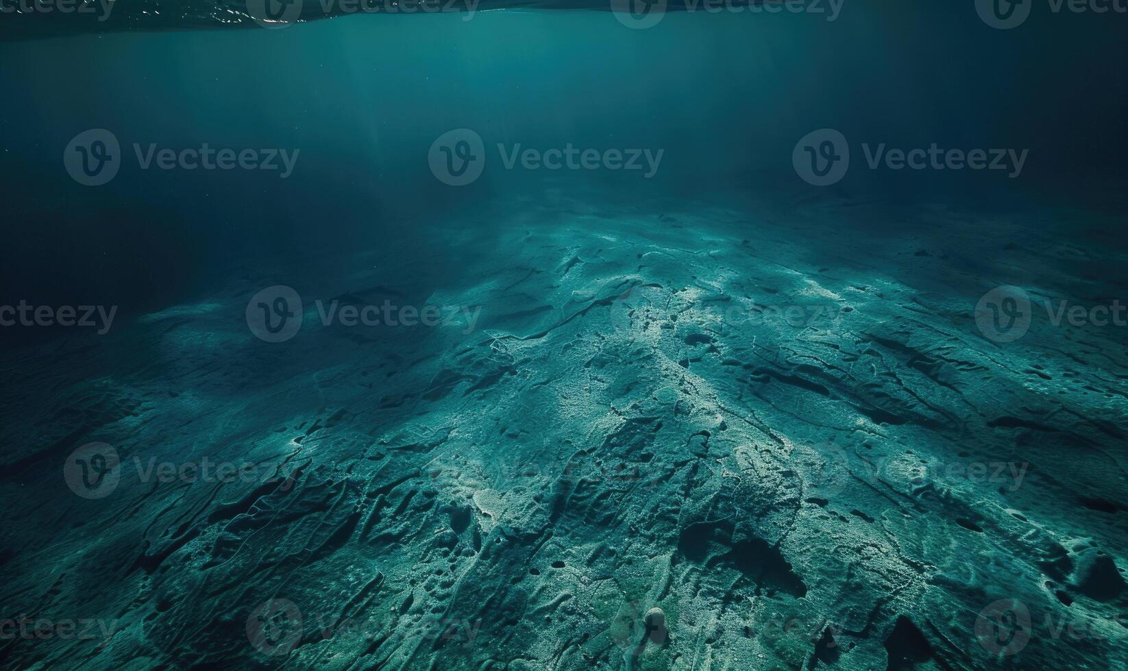 underwater scene with sun rays and seafloor photo