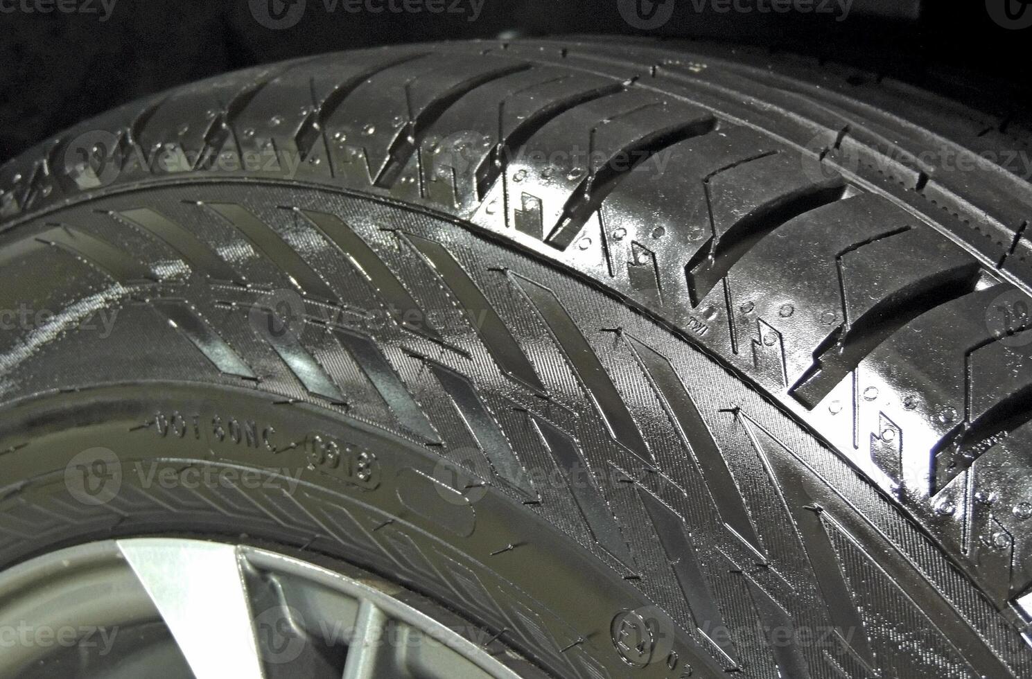 Sidewall of car tire after rubber cleaner treatment detailed photo