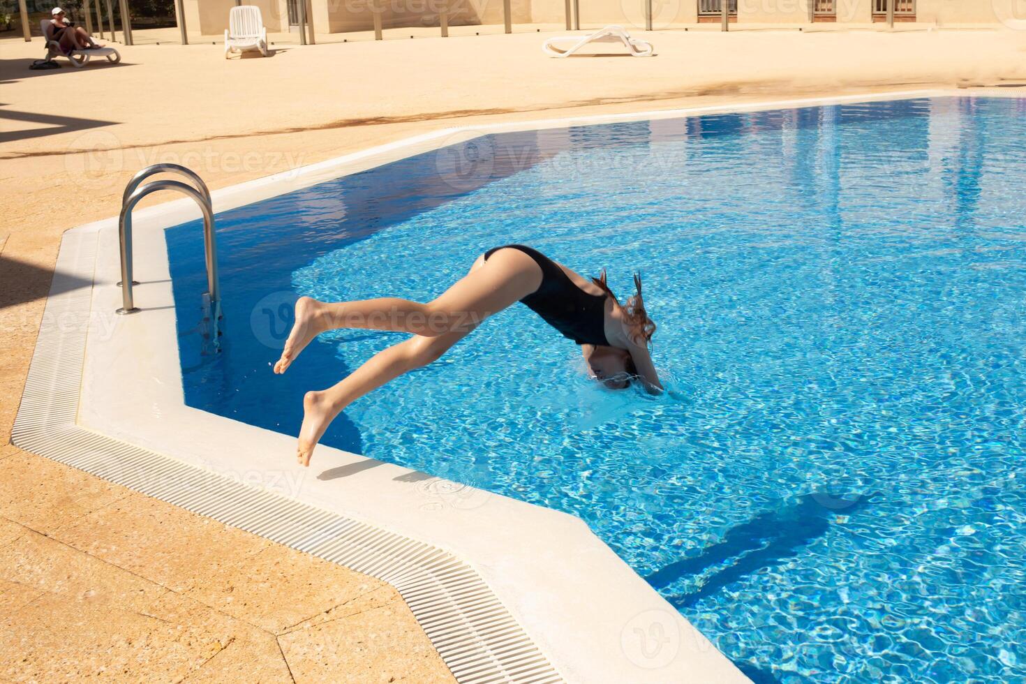happy children playing and having fun in the pool during the holidays. beautiful pool for vacation. blue background, sea background. step 4 photo